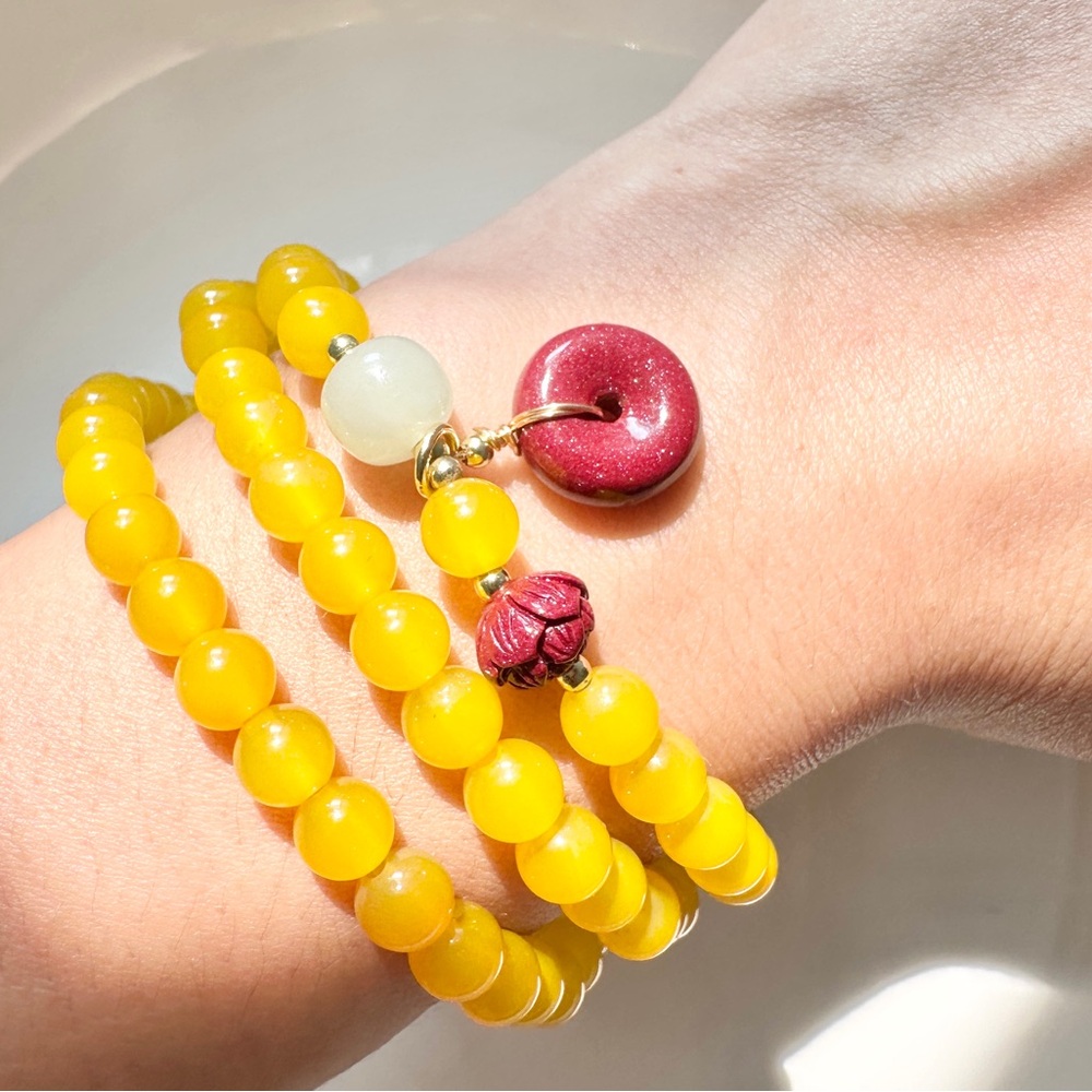 Triple Yellow Beaded Bracelet with Red Charm